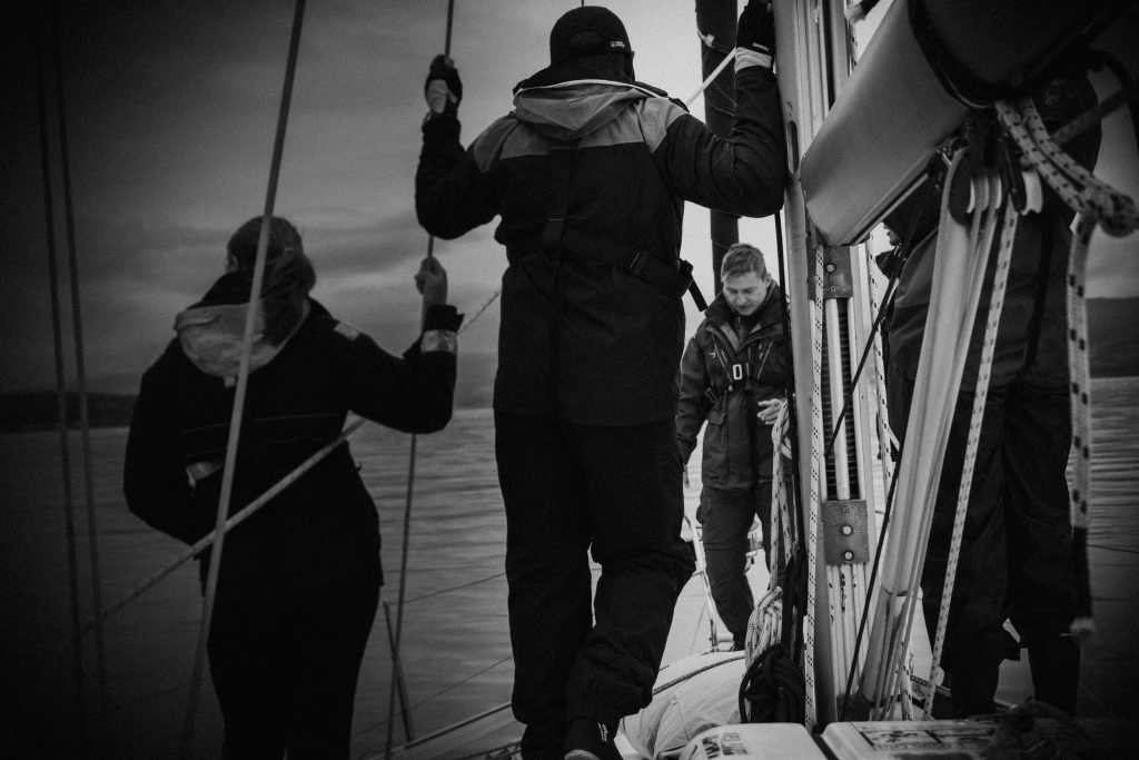 Sailing instructor teaching students onboard a yacht